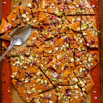 persian candy pistachio brittle broken into pieces on silicone pastry mat