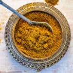 spoon in a bowl of homemade moroccan spice blend