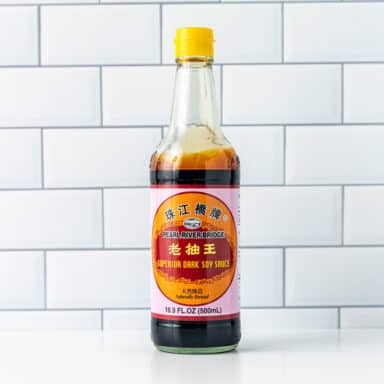 dark soy sauce bottle on white tabletop