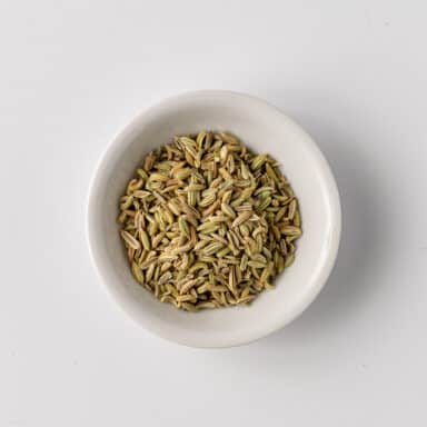 fennel seeds in small white bowl