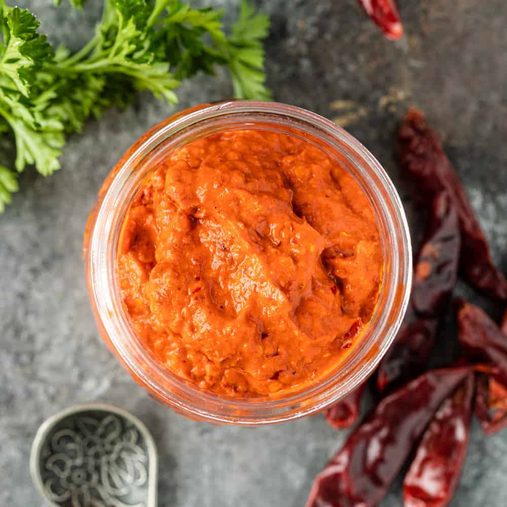 red moroccan harissa paste in glass jar