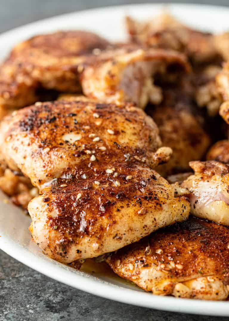 close up image of pan seared chicken thighs rubbed with a North African chicken spice blend