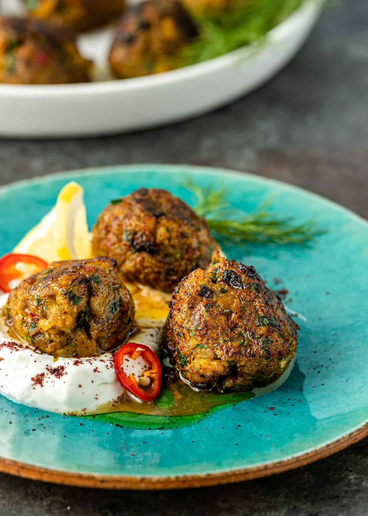 dish of Middle Eastern fish meatballs in homemade labneh