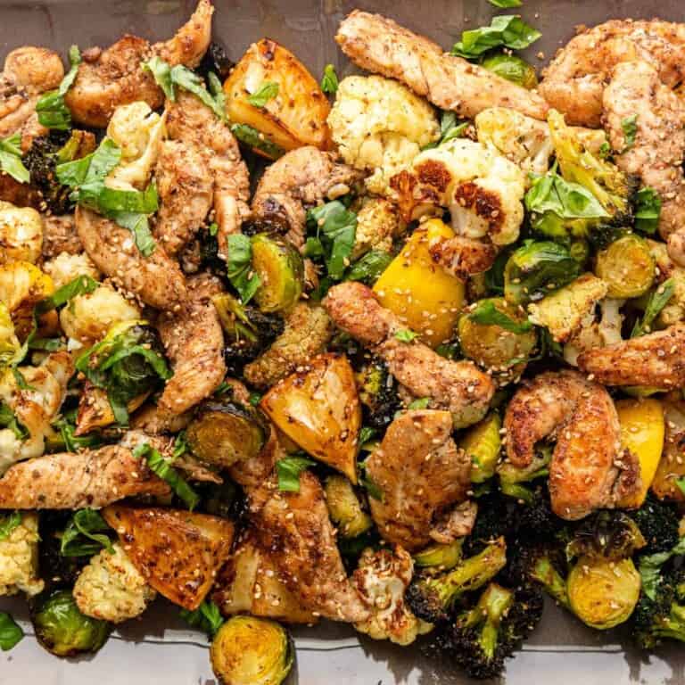 closeup: Greek roasted vegetables and sesame chicken tenders