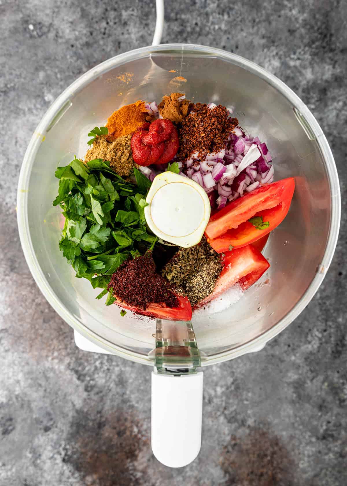 overhead image: large mixing bowl with fresh vegetables and spices to make lahmacun