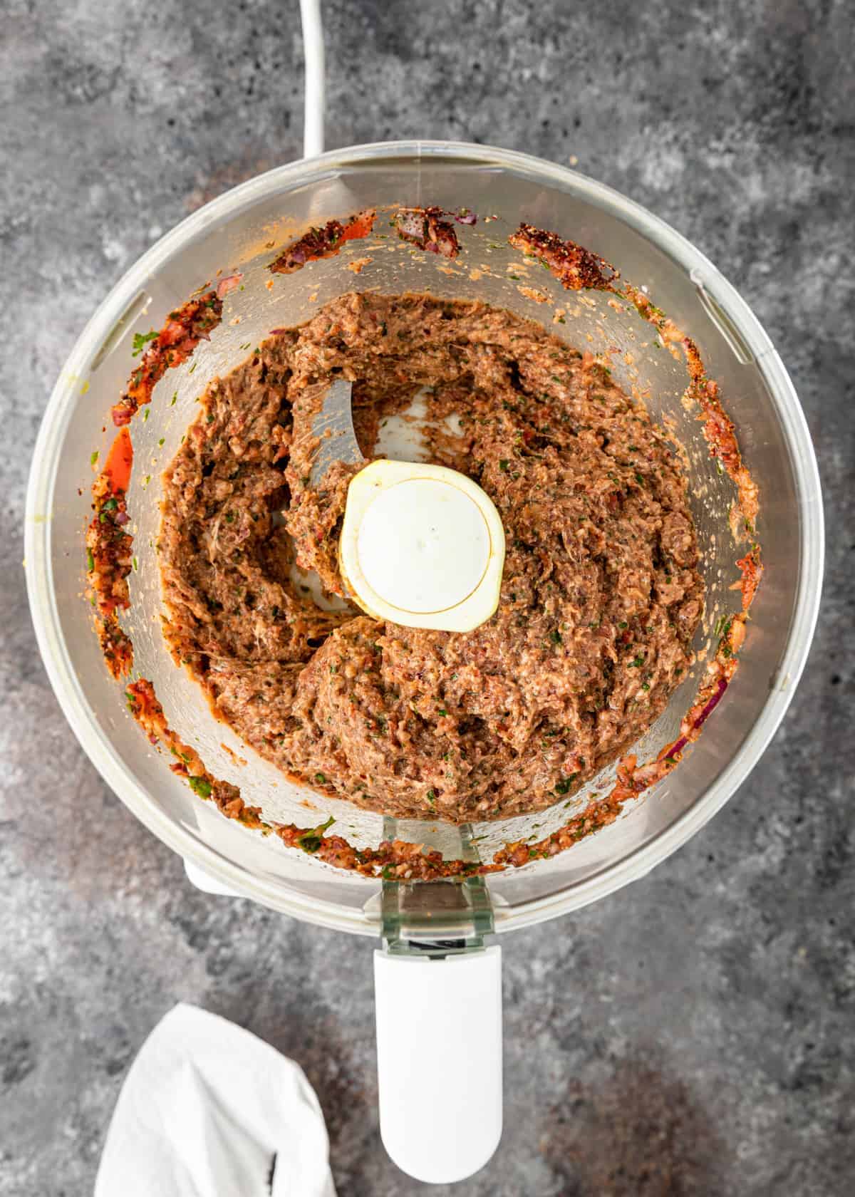 overhead image: combining ingredients in food processor for lahmacun recipe