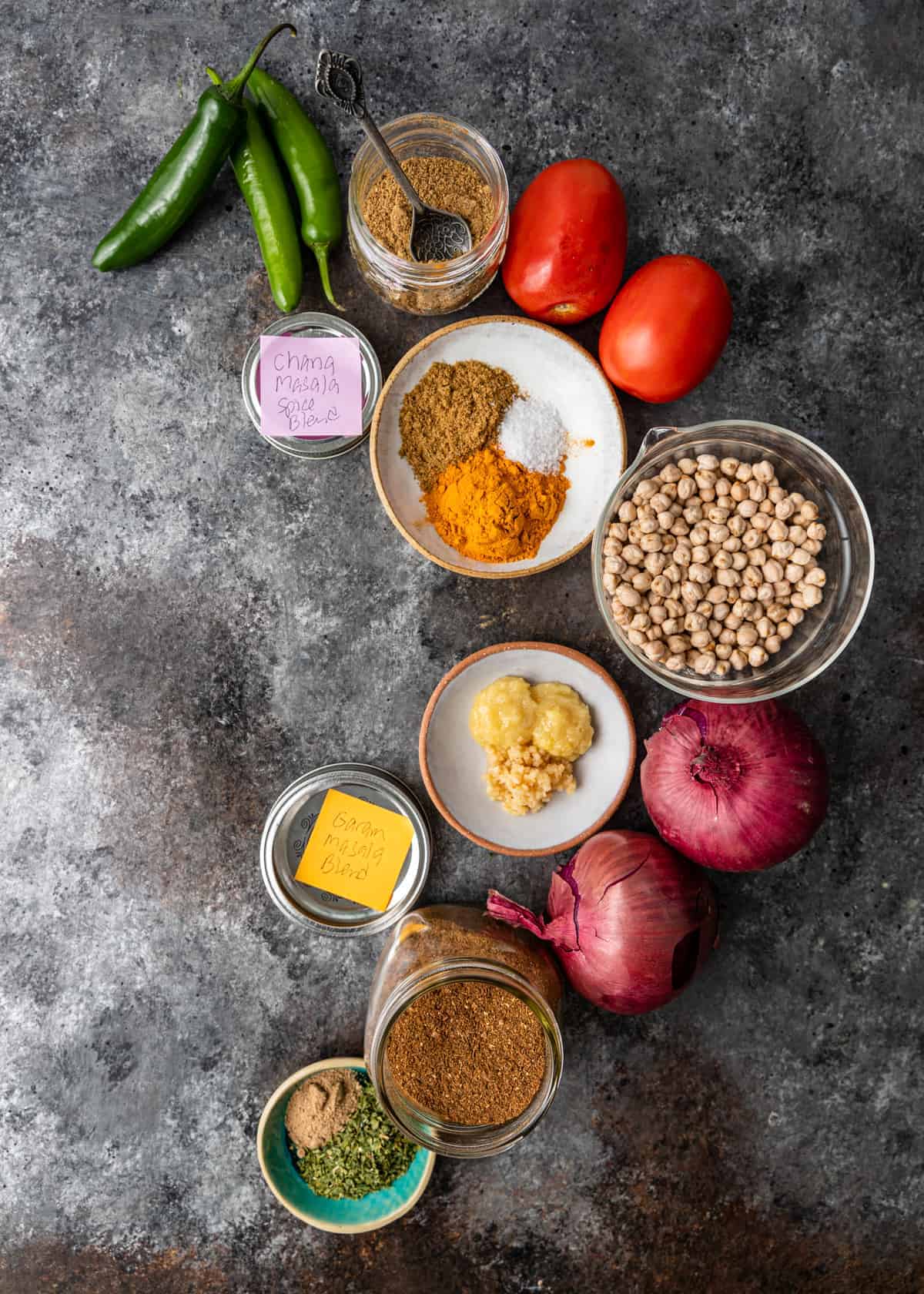 spices, dry chickpeas, roma tomatoes and other ingredients to make chana masala instant pot curry recipe