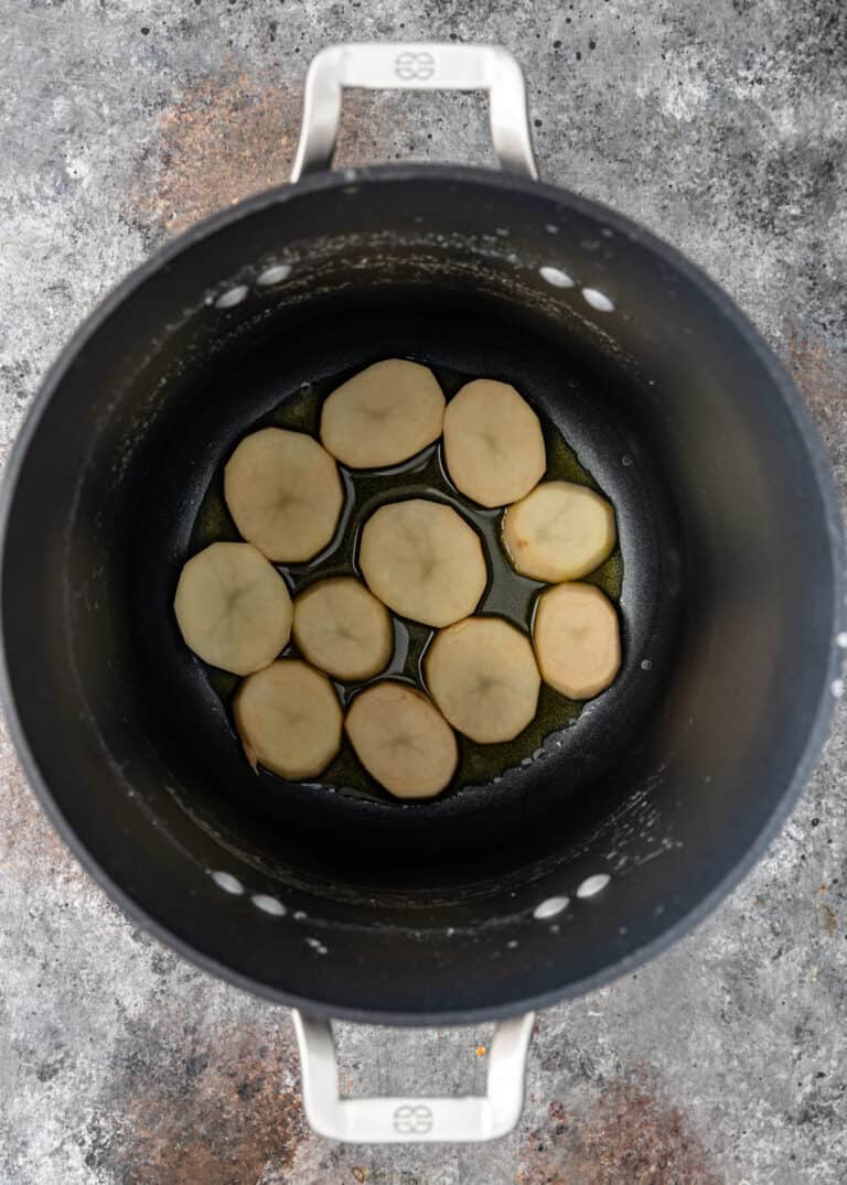 potato slices in oil for an Iranian rice tahdig