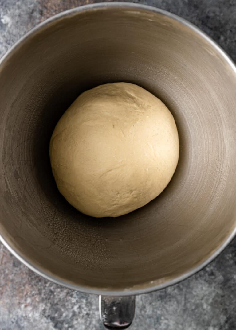 overhead: ball of zaatar bread dough in mixing bowl