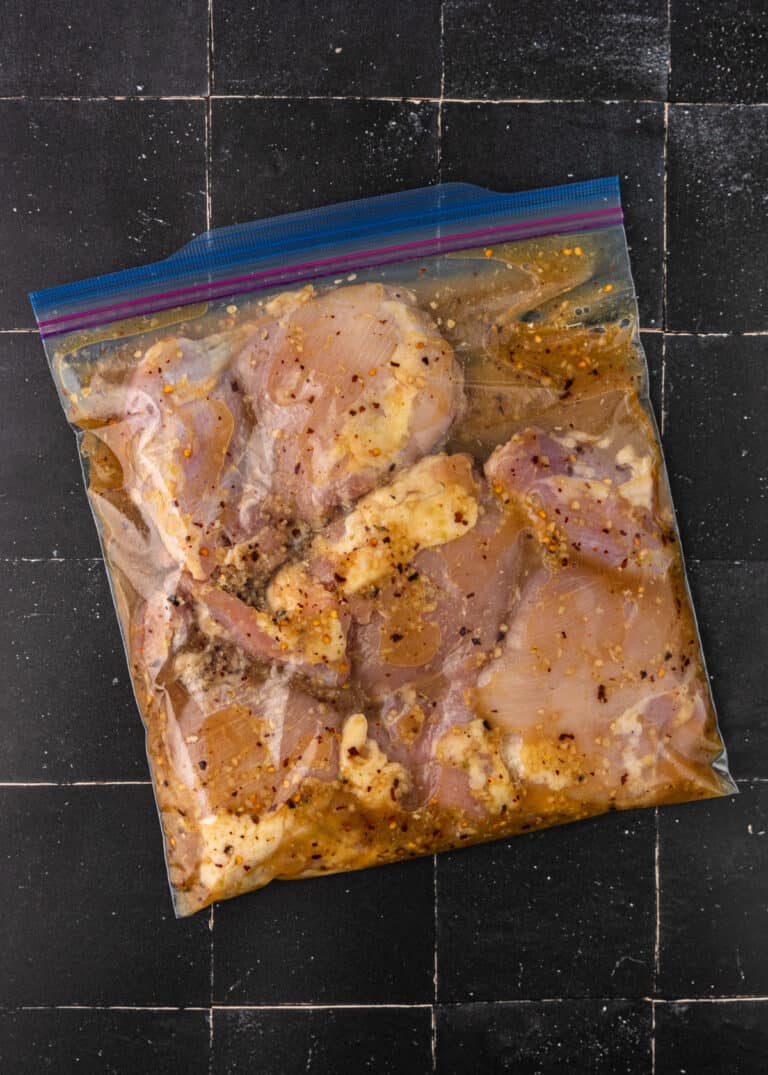 boneless chicken thighs in Ziploc bag with Asian chicken marinade