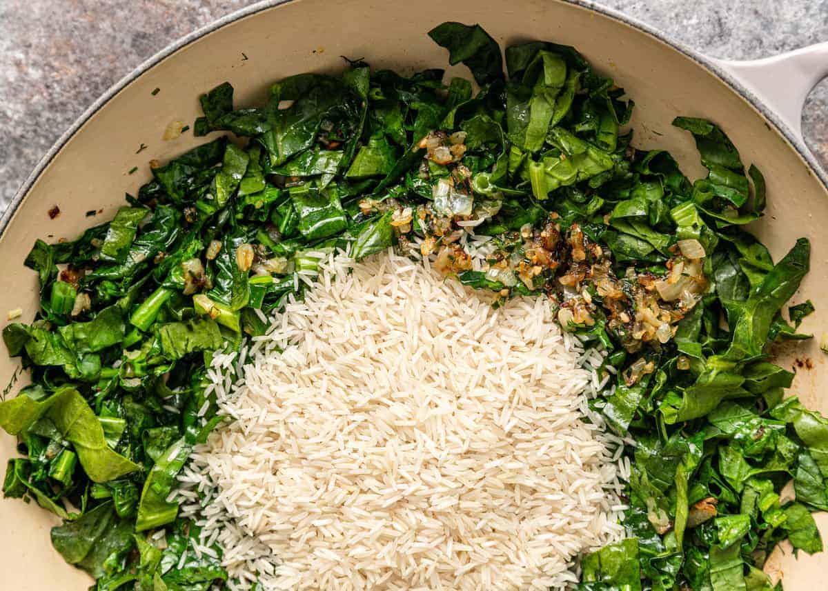 sauteing spinach rice and garlic in saute pan