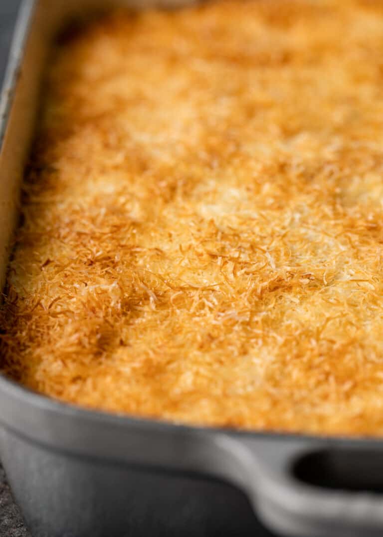 golden brown kefalotyri cheese on top of greek lasagna
