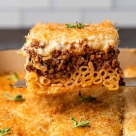 slice of greek lasagna shown close up