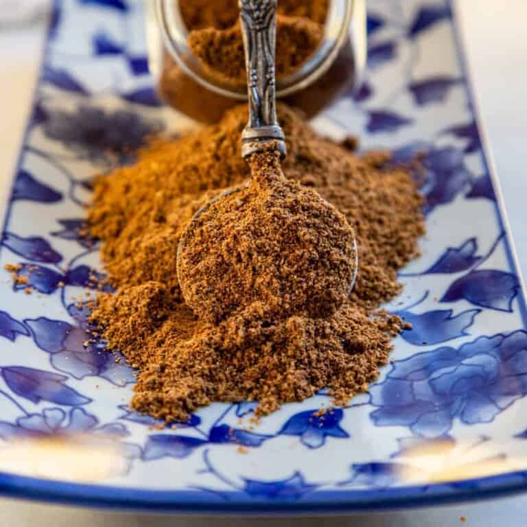 close up image: ground szechuan seasoning on spoon