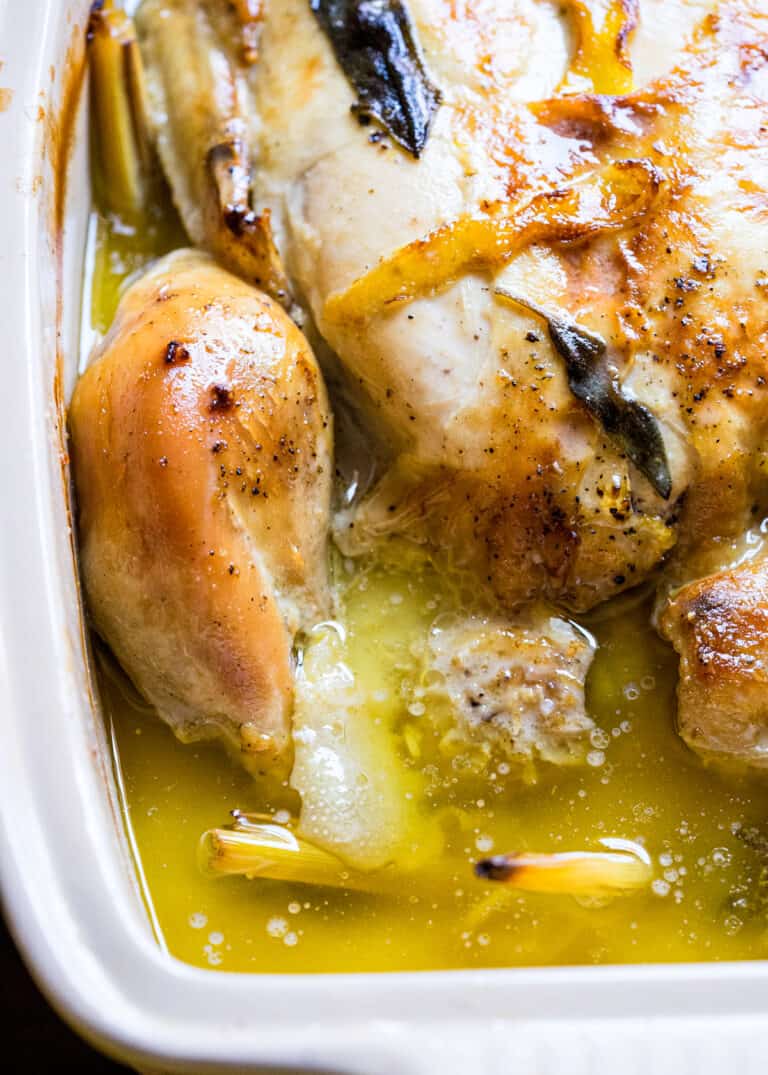 close up of Thai roasted chicken in pan with lemon butter