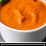 close up image: small white bowl with creamy red Indian condiment