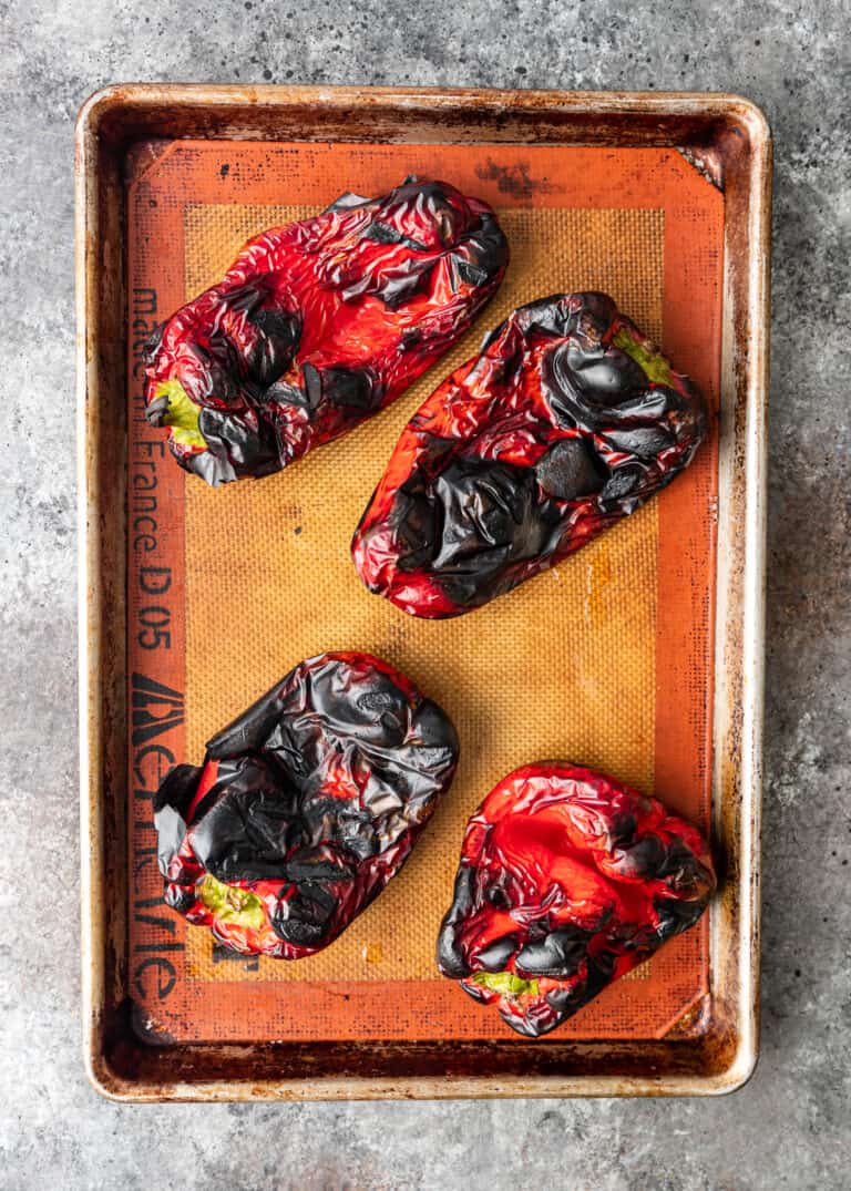 roasted red peppers on baking sheet for turkish pepper paste