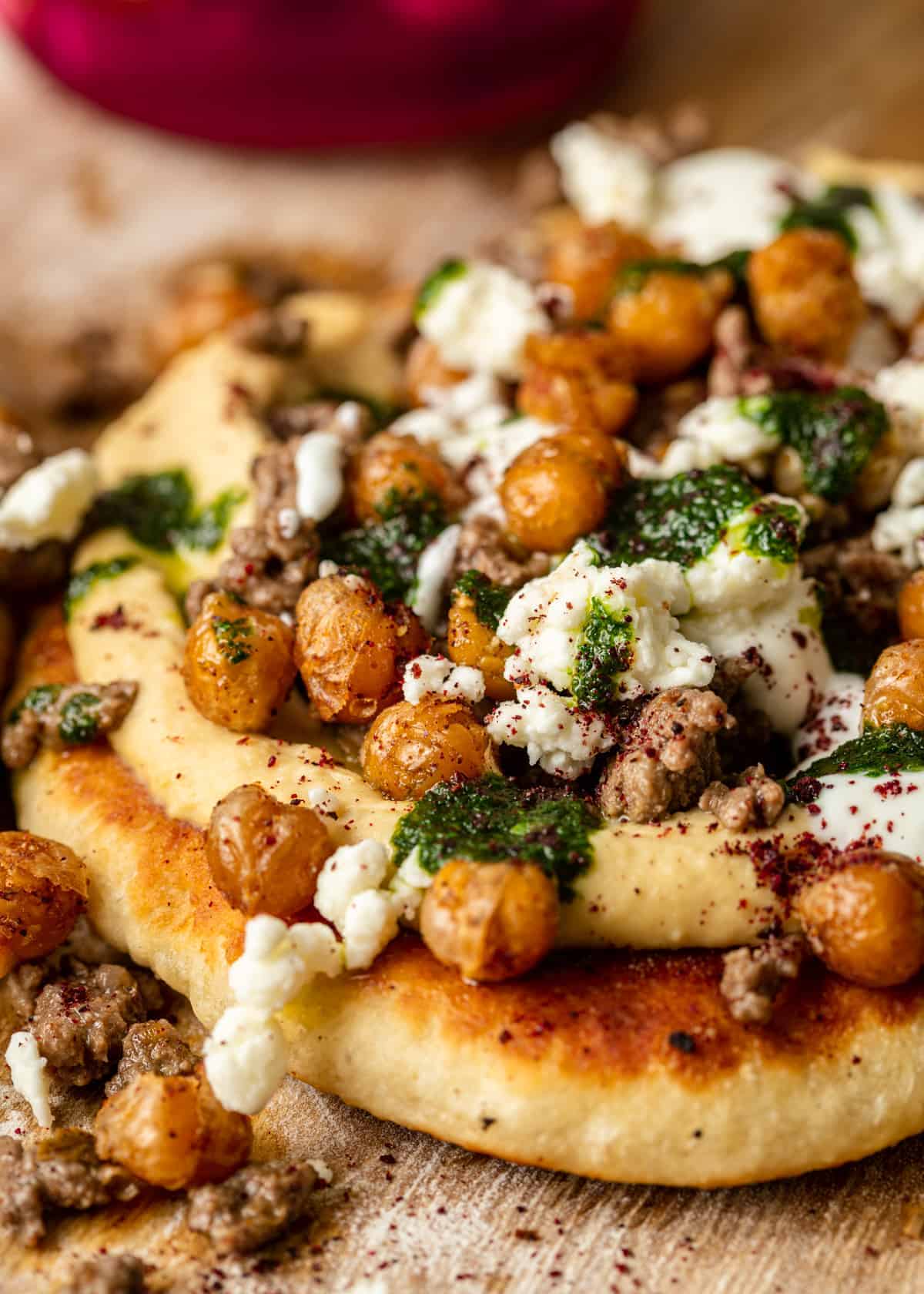 close up of stovetop pizza with mediterranean toppings