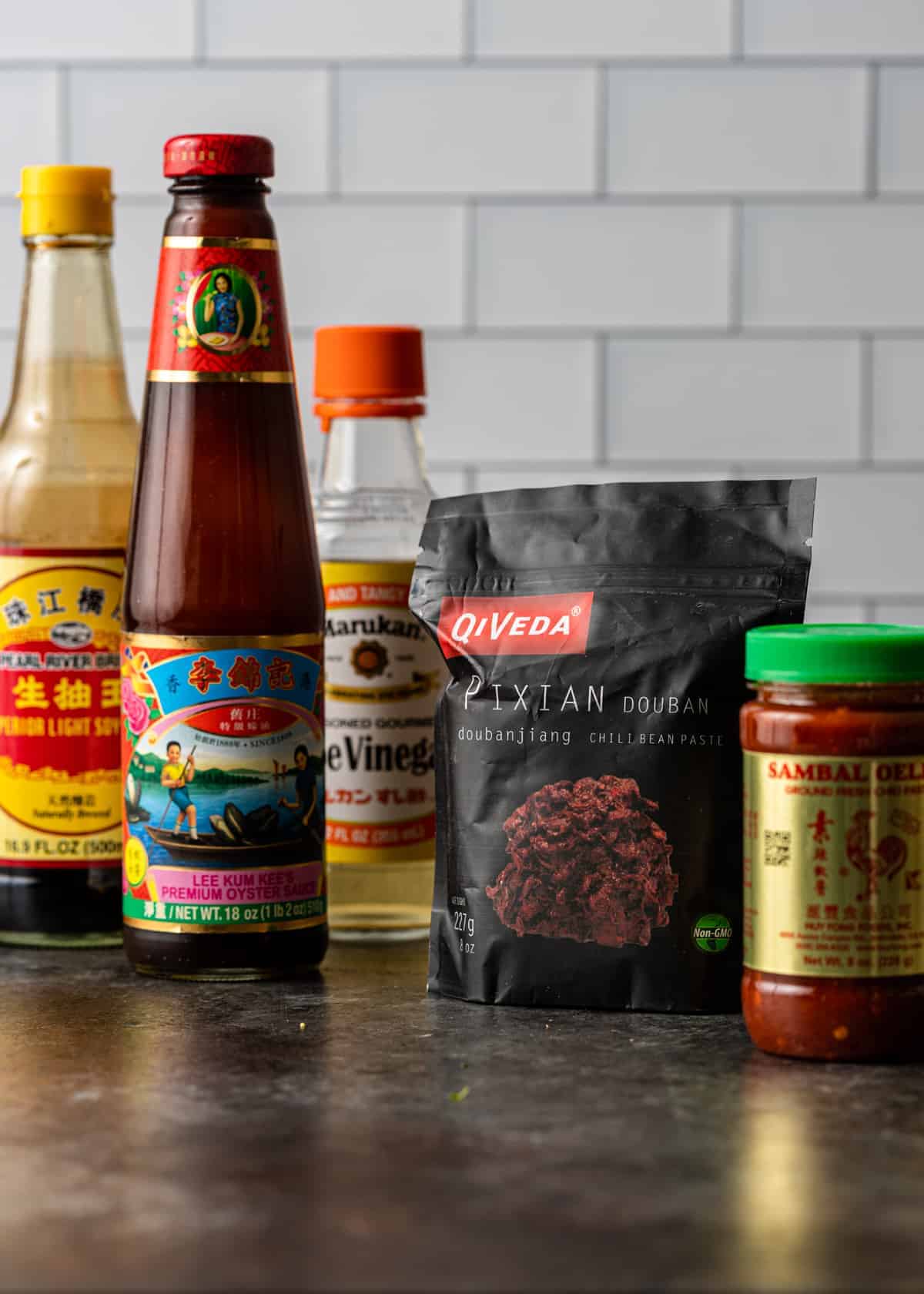 bottles of ingredients to make a spicy hunan chicken recipe