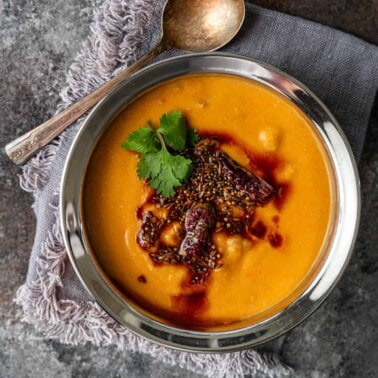 overhead: bowl of creamy turkey lentil soup with tadka