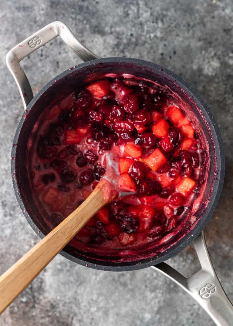 cooked cranberries and apples in saucepan