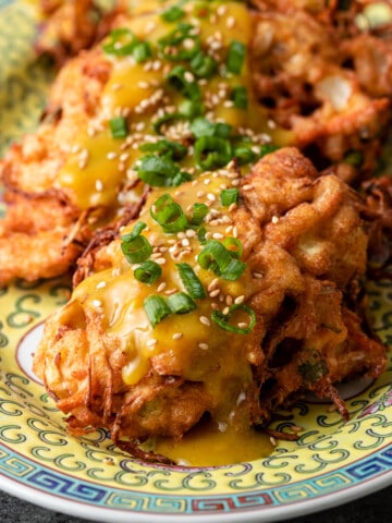 close up of chicken egg foo young on platter