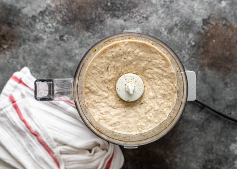 overhead: creamy cannellini bean hummus in food processor bowl