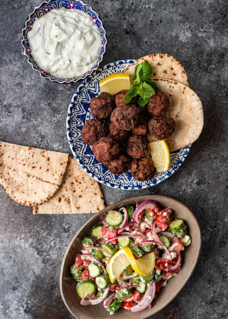 Greek meatballs ready to serve with dipping sauce. 