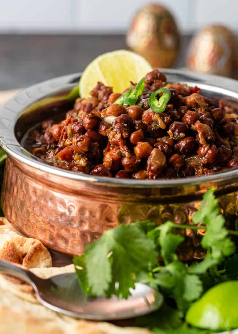 dish of spicy kala chana garnished with green chilies
