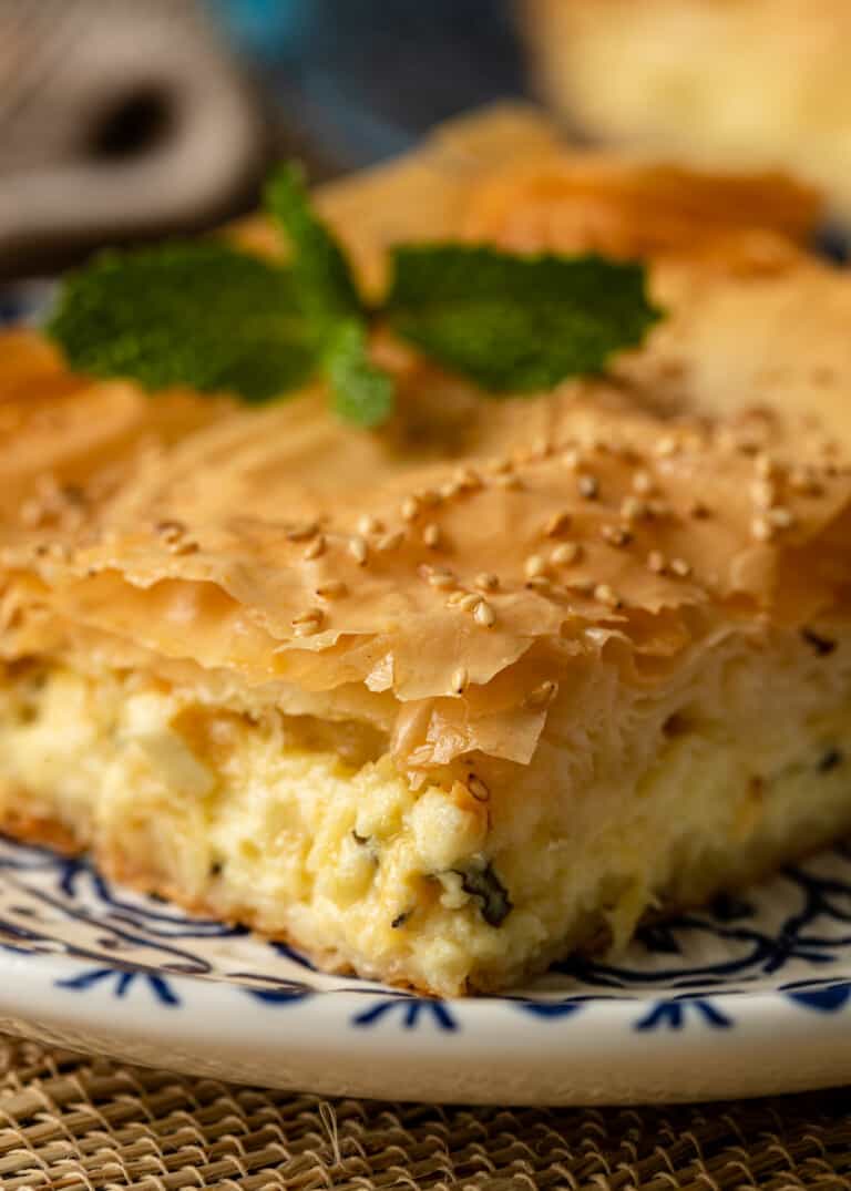 close up of greek cheese pie on plate