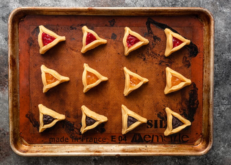 Hamantaschen cookies ready to bake on a pan
