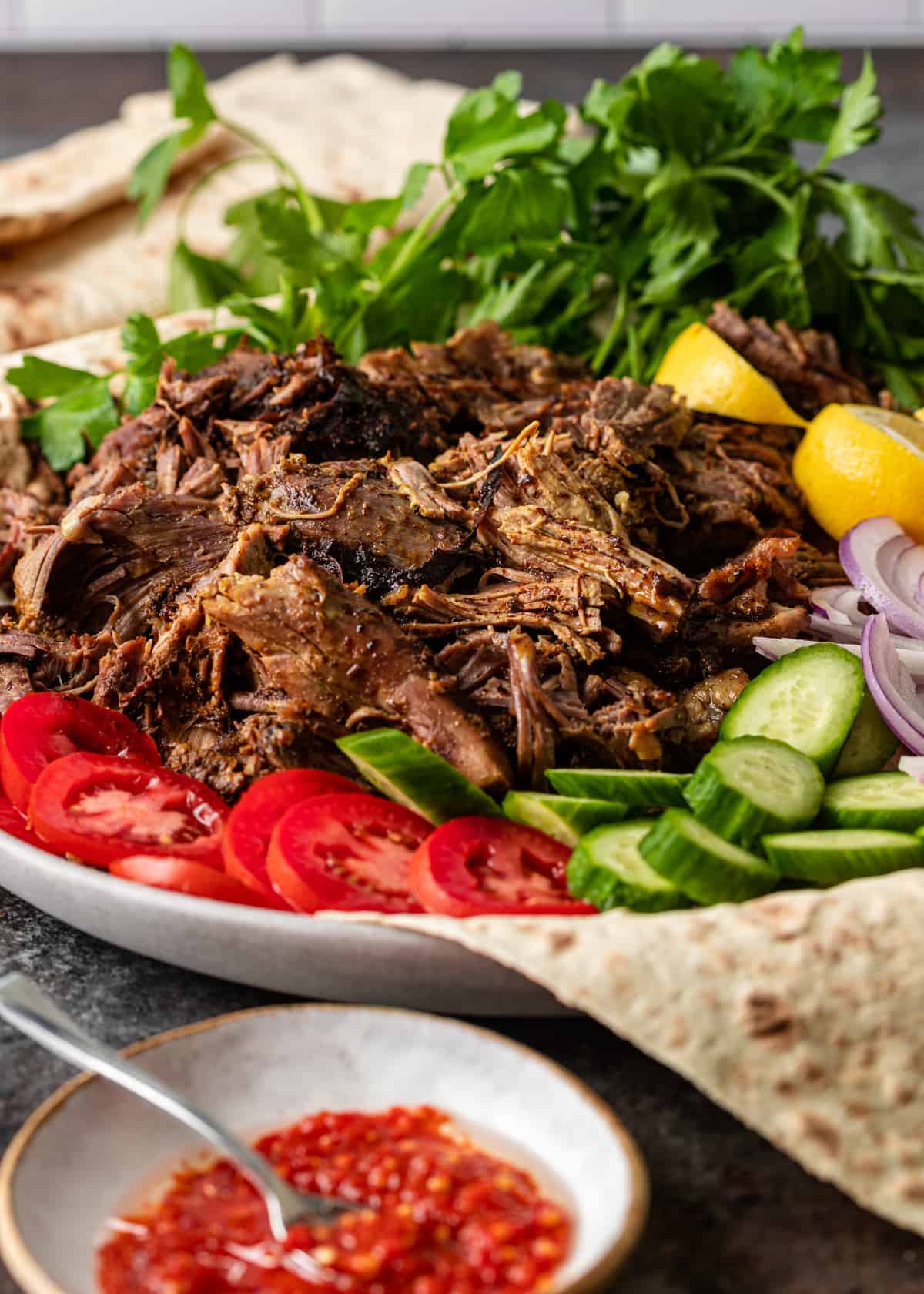closeup: lamb shawarma recipe on a plate with toppings