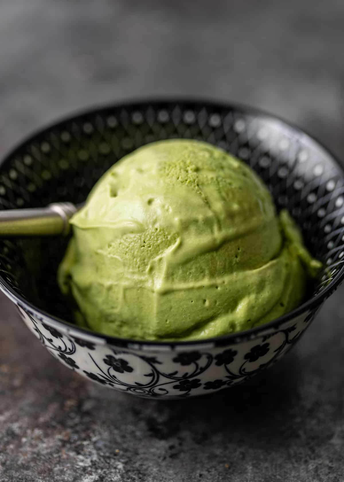 scoop of matcha green tea ice cream in bowl