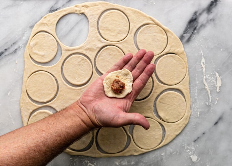 adding filling to dough