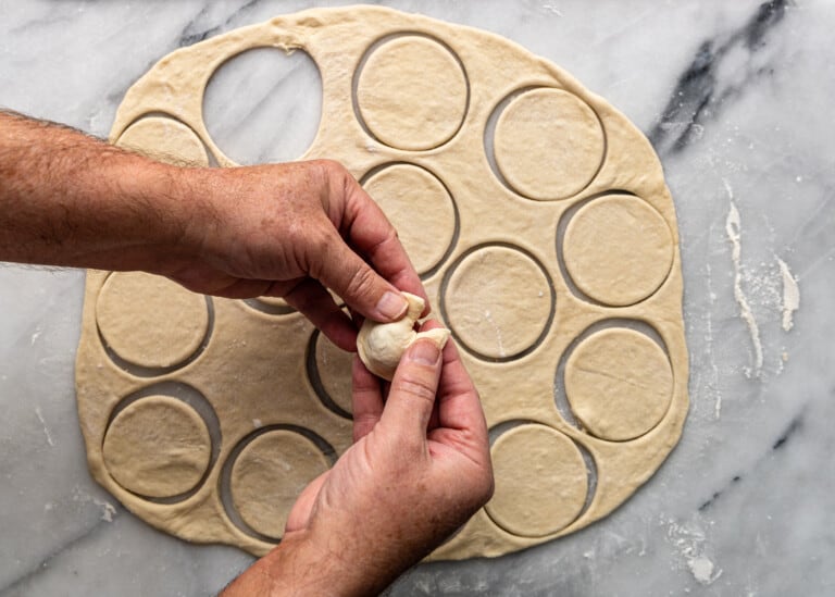 pinching the ends of dough together.