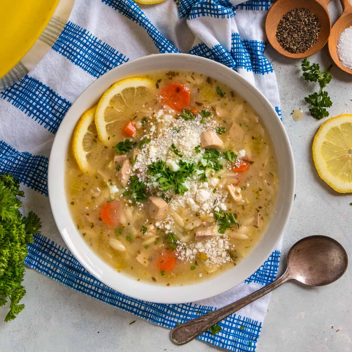 bowl filled with green chicken orzo soup