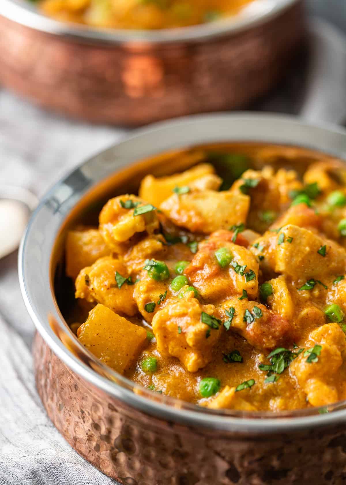 up close side view of Indian Chicken Curry in a bowl