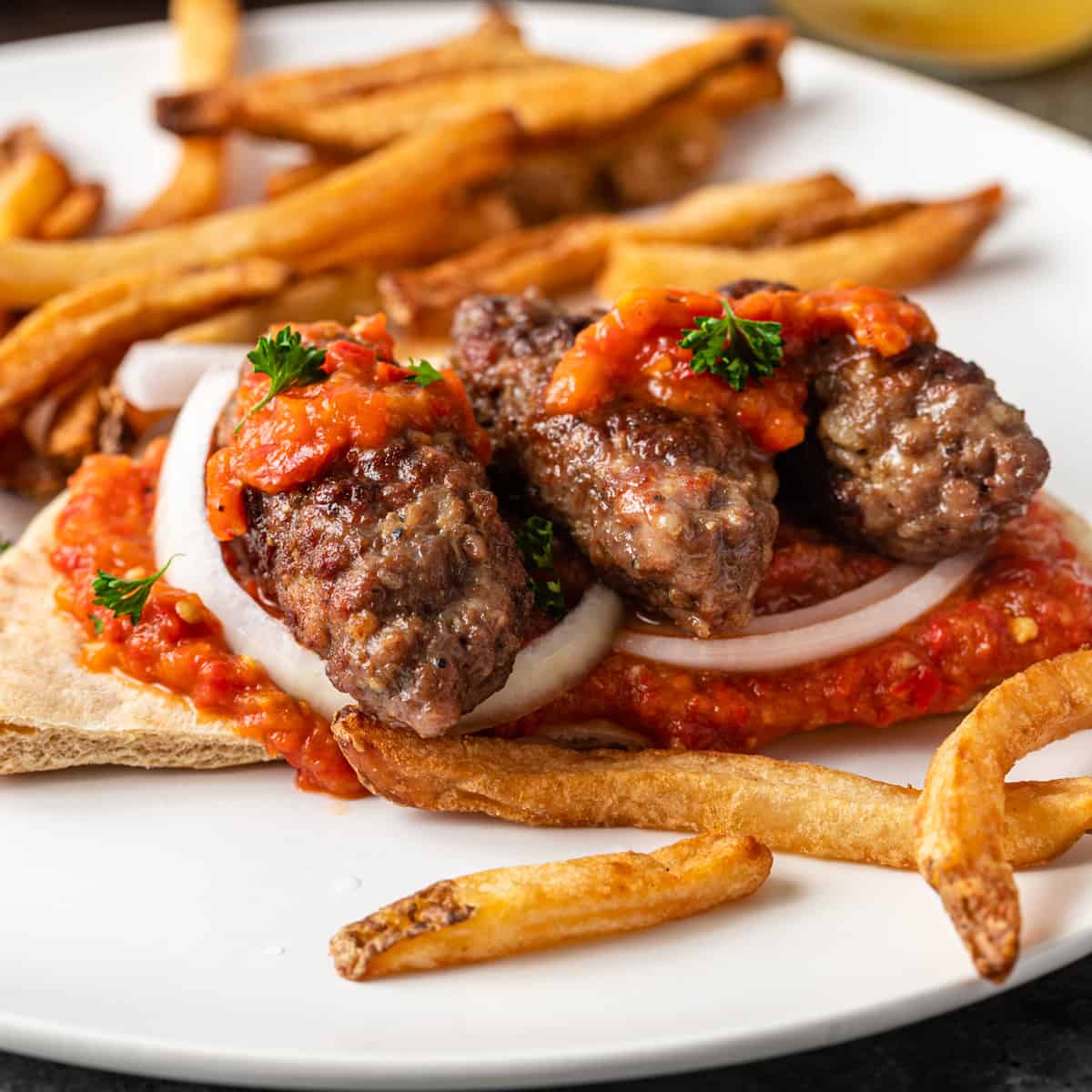 Cevapi Balkan Skinless Sausages on a plate with fries