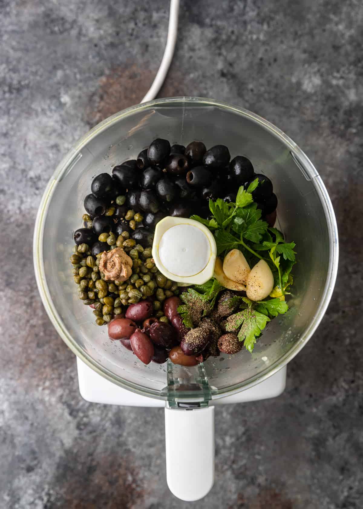 blending herbs and olives
