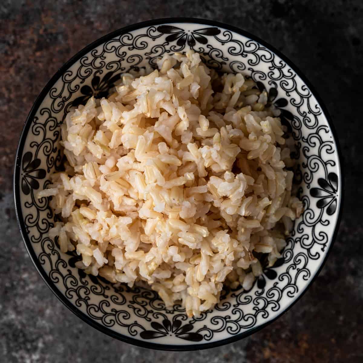 brown rice in a black and white bowl