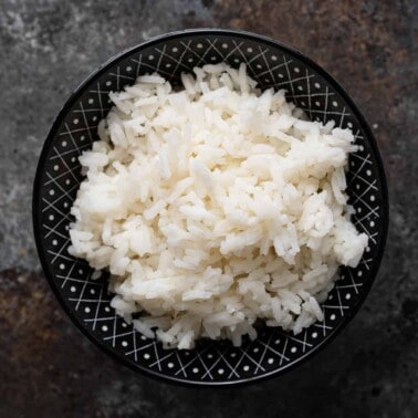 steamed white rice in black bowl