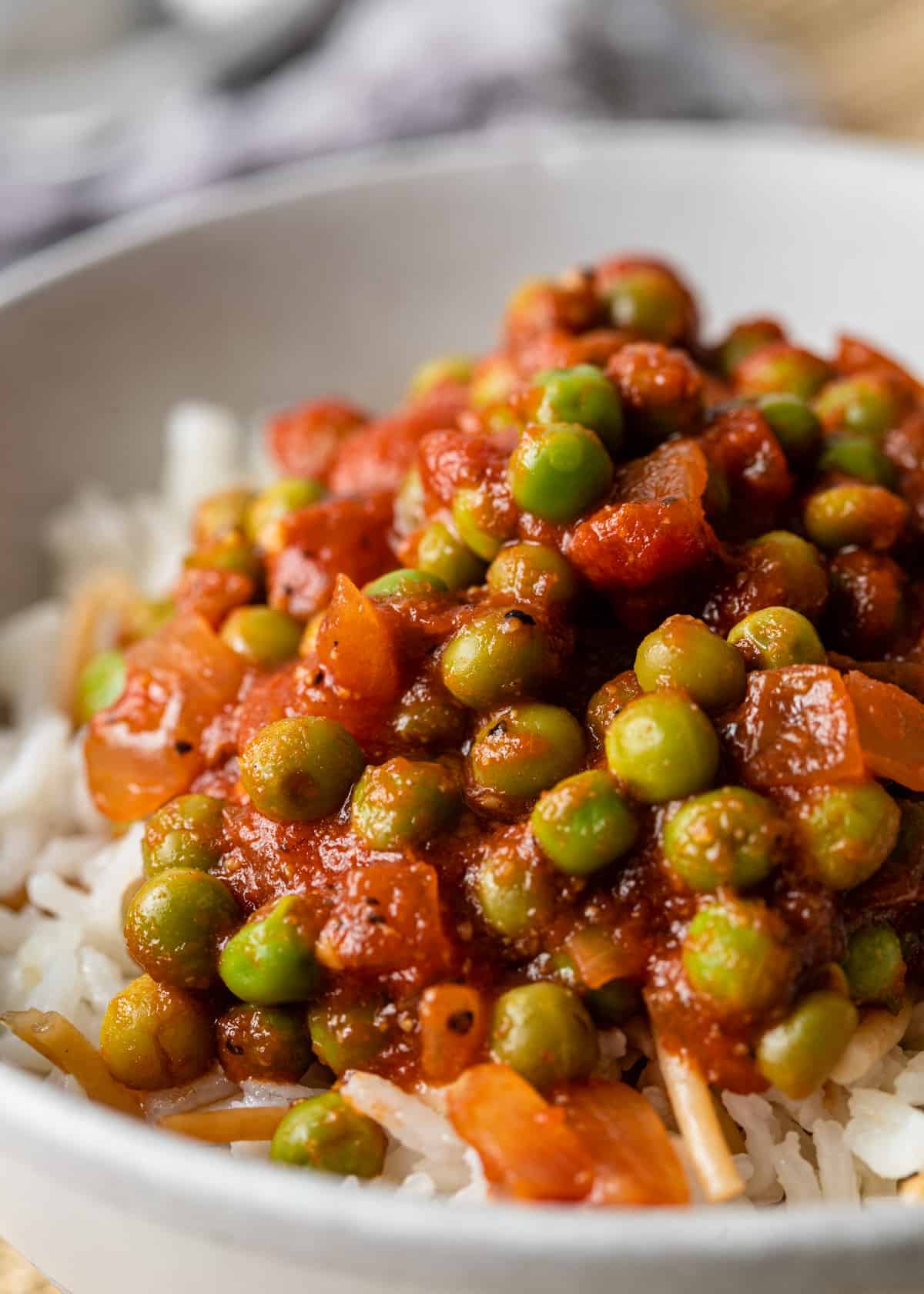 close up of Egyptian pea stew in a bowl with rice