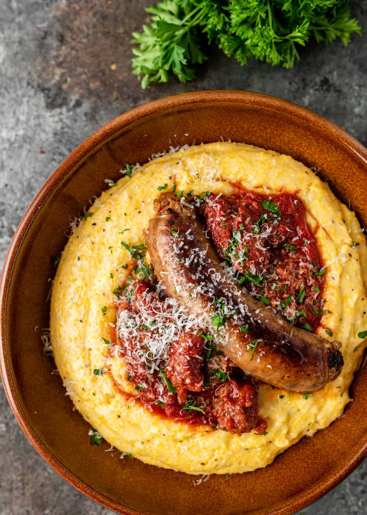overhead closeup: ragu with Italian sausage over creamy polenta