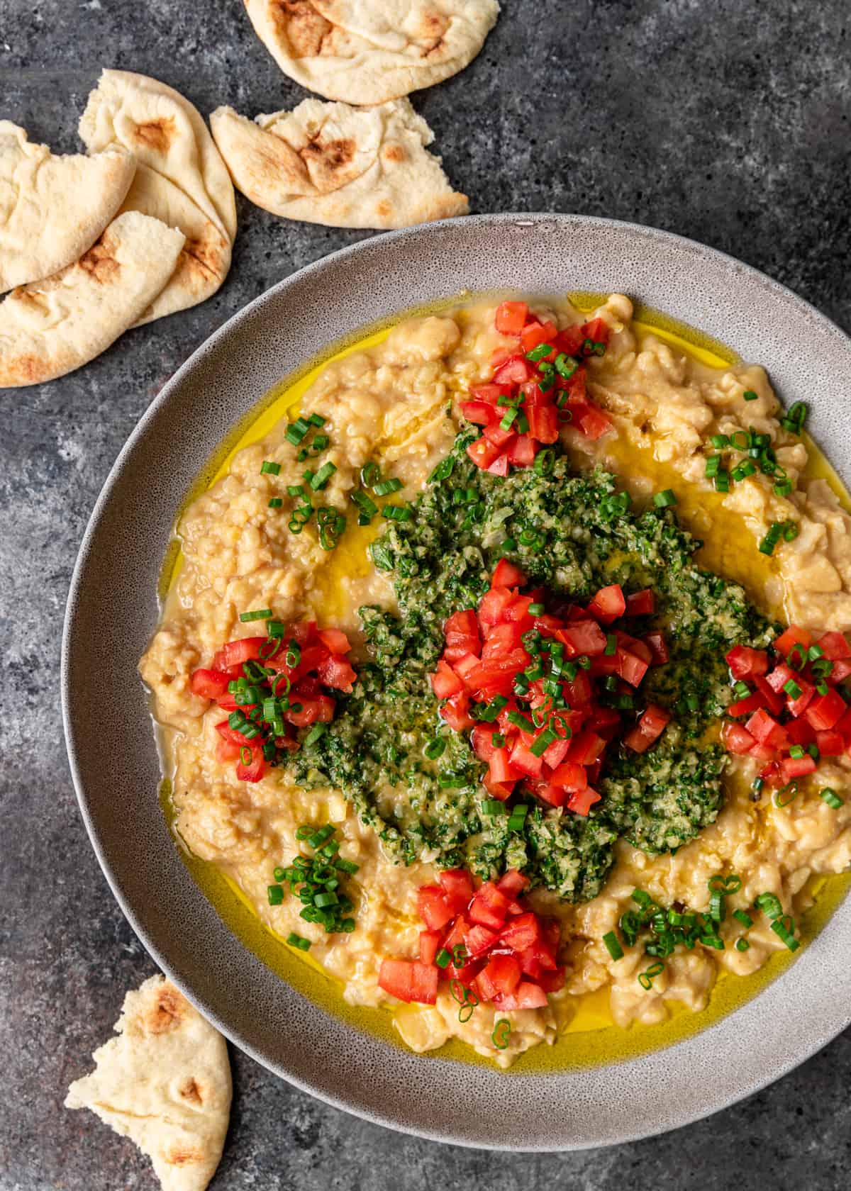 overhead: a plate of Lebanese ful medames with pita bread