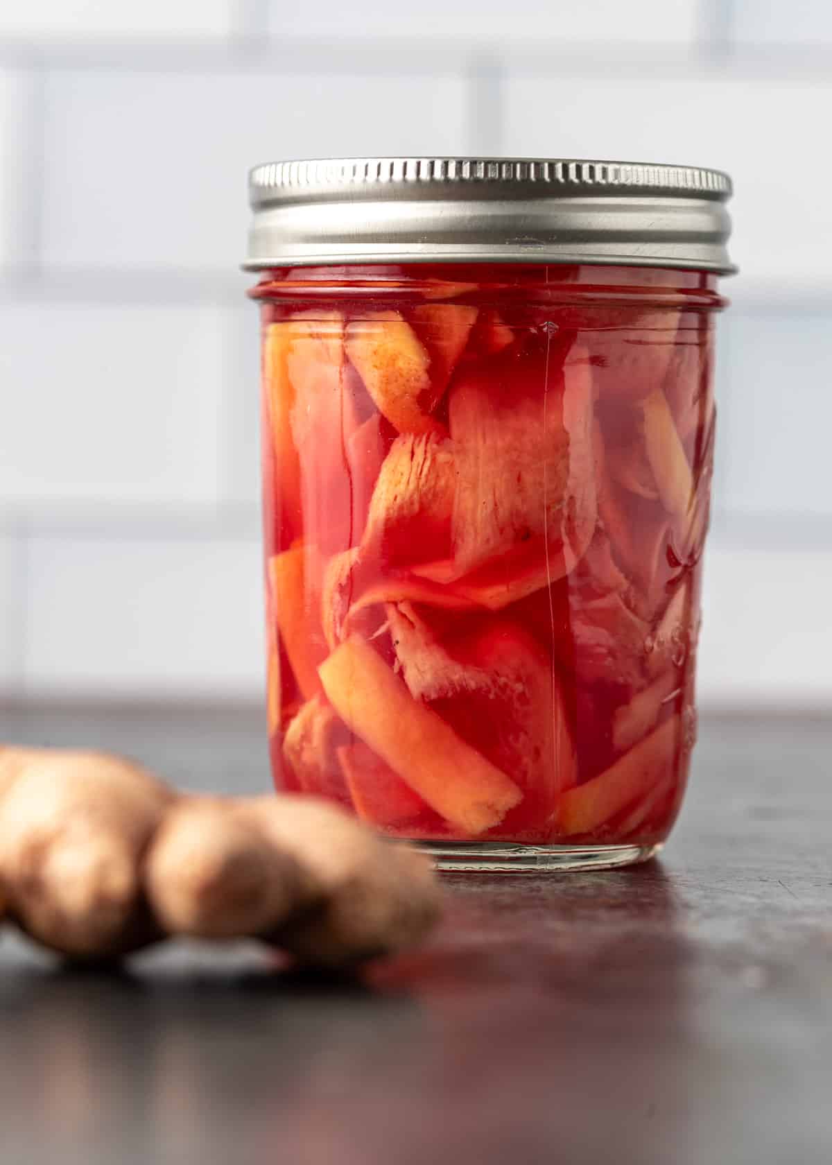 closeup: pickled ginger recipe in a glass jar with a lid