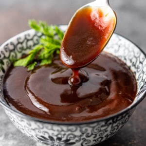 tonkatsu sauce in bowl with spoon dripping sauce