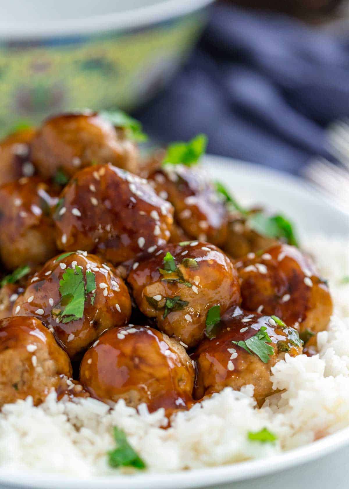 closeup: turkey meatballs with glaze on top of white rice