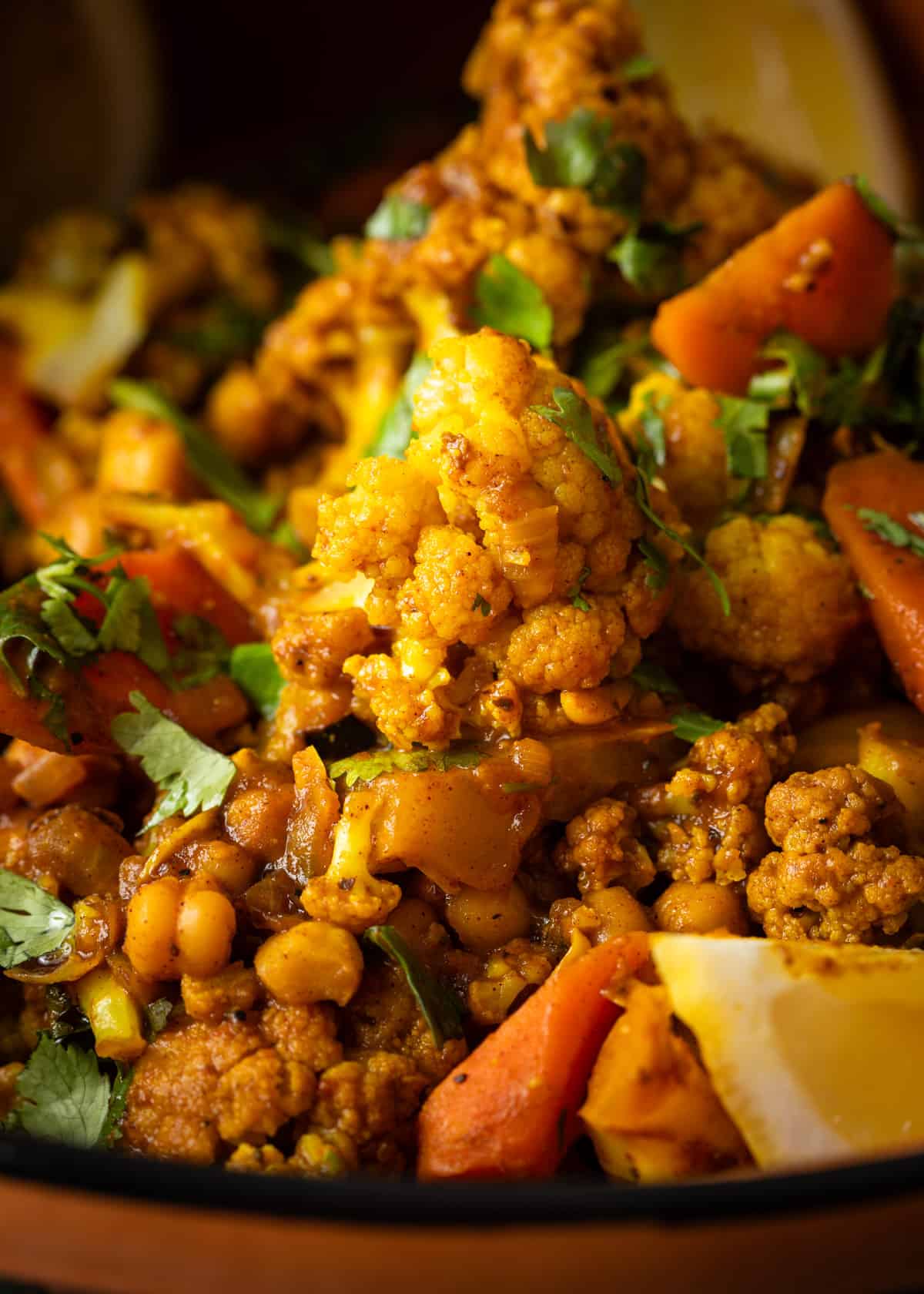 extreme closeup: vegetable tagine recipe with cauliflower and other vegetables showing