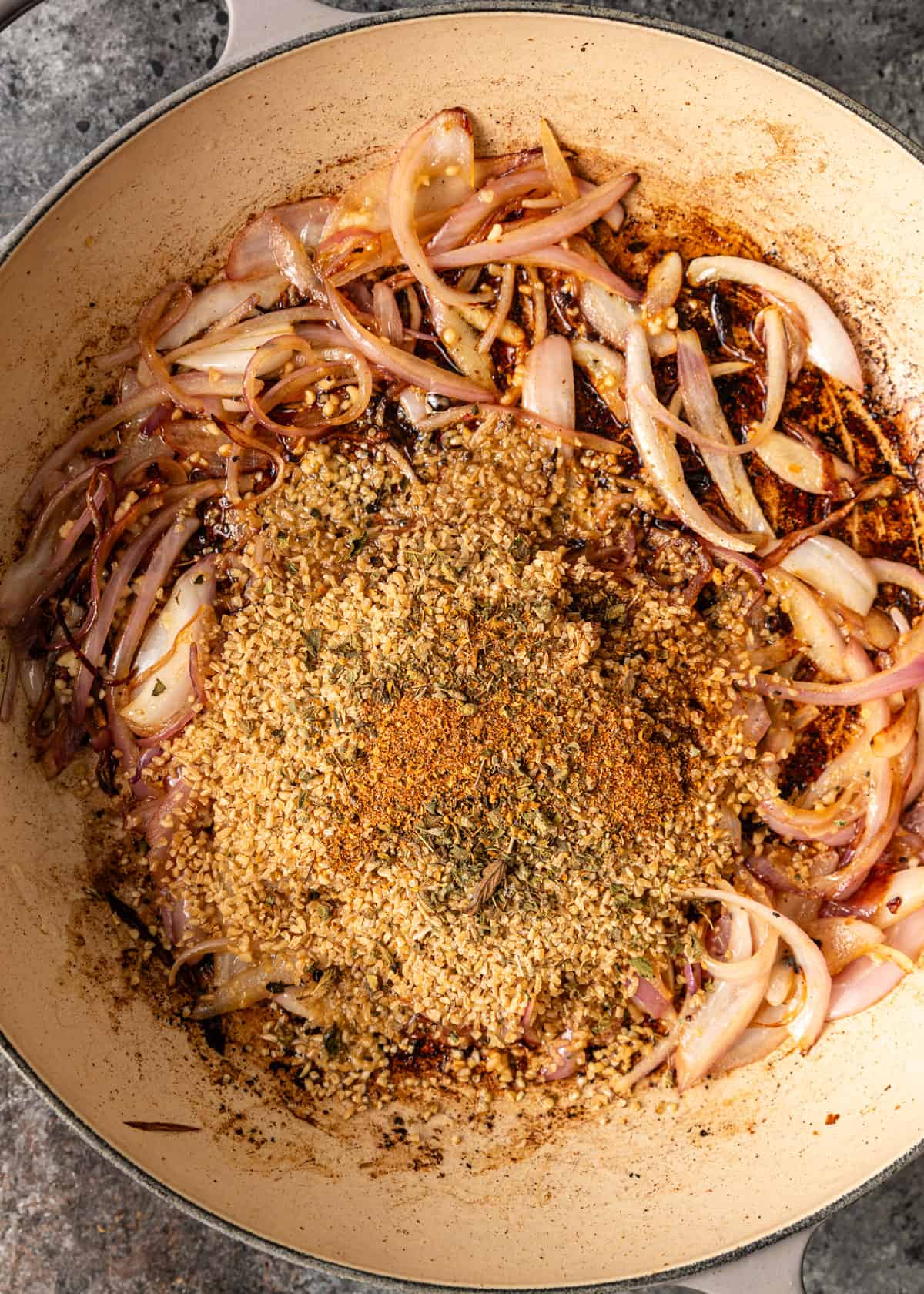 overhead: sauteed onions with bulgur and oregano